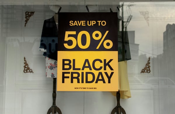 Photo shows a Black Friday sales sign on a shop window.