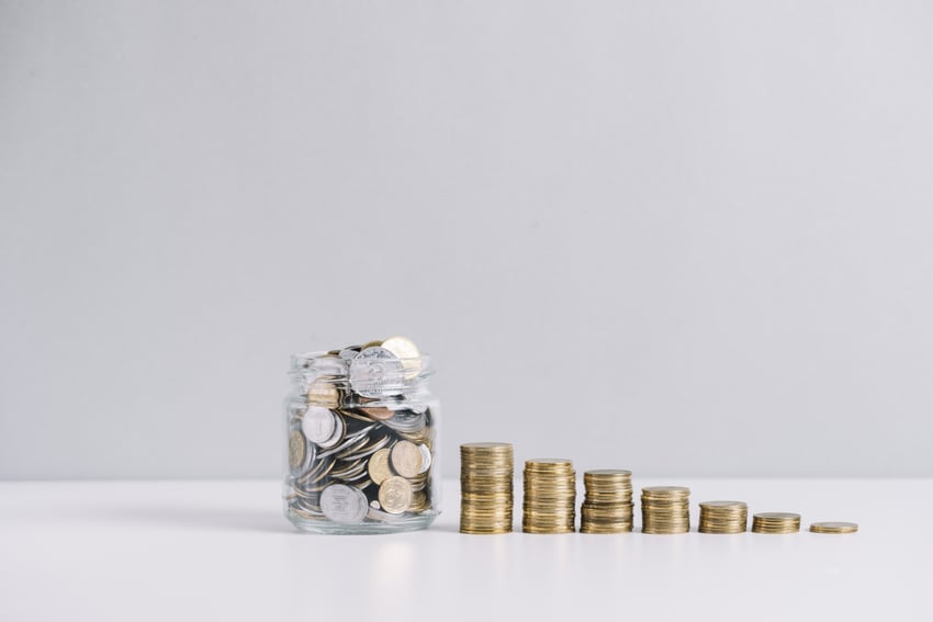 glass-jar-full-money-front-decreasing-stacked-coins-against-white-background