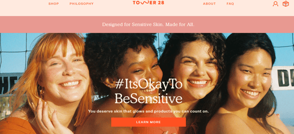 Tower28 beautybrand's website, with four models in the main banner, with the title #ItsOkayToBeSensitive. The website is made in tones of red, pink and orange, and its a statement on how to start a makeup business.